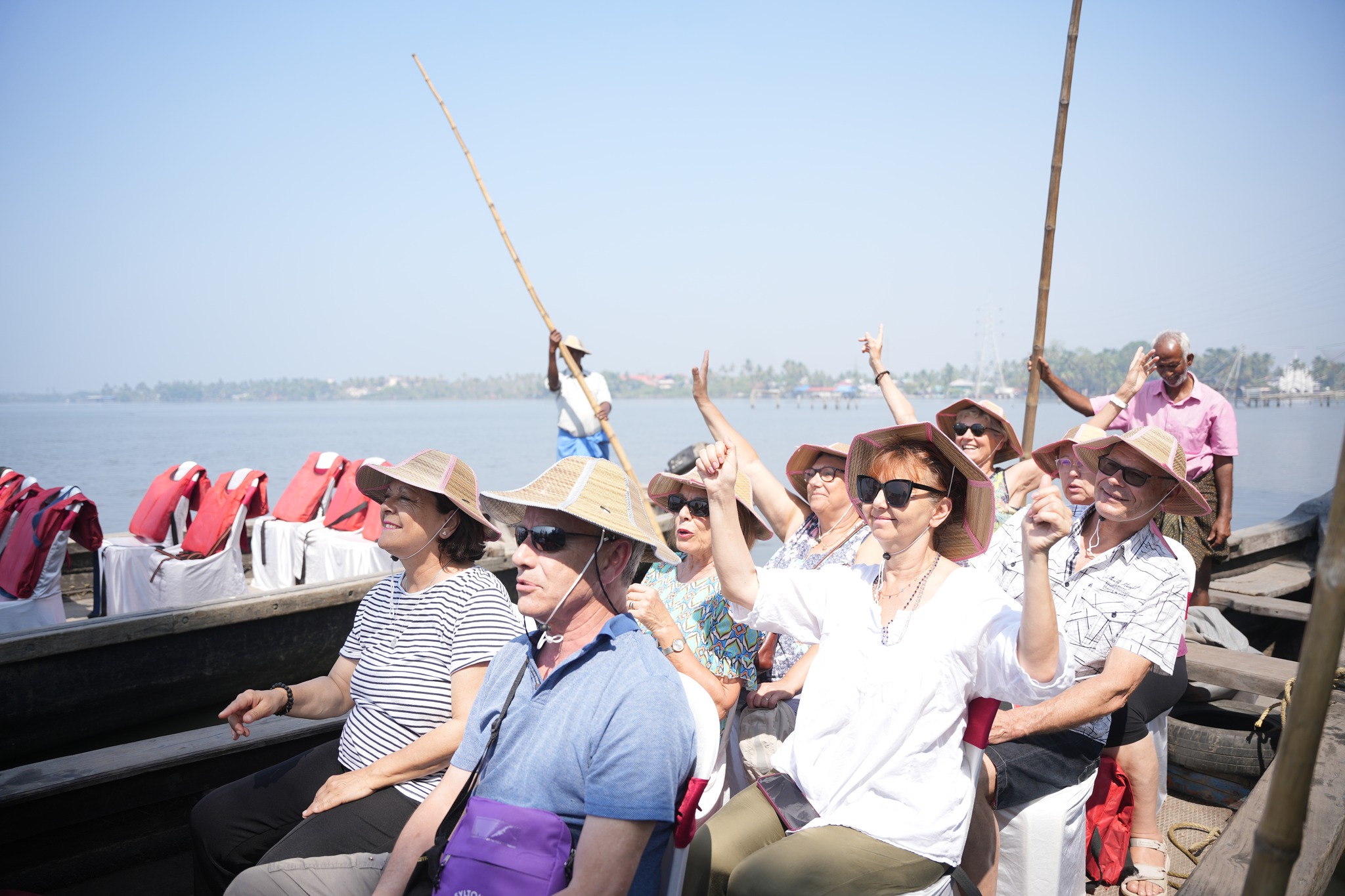 Guests enjoying a traditional boat ride on the Kumbalangi backwaters