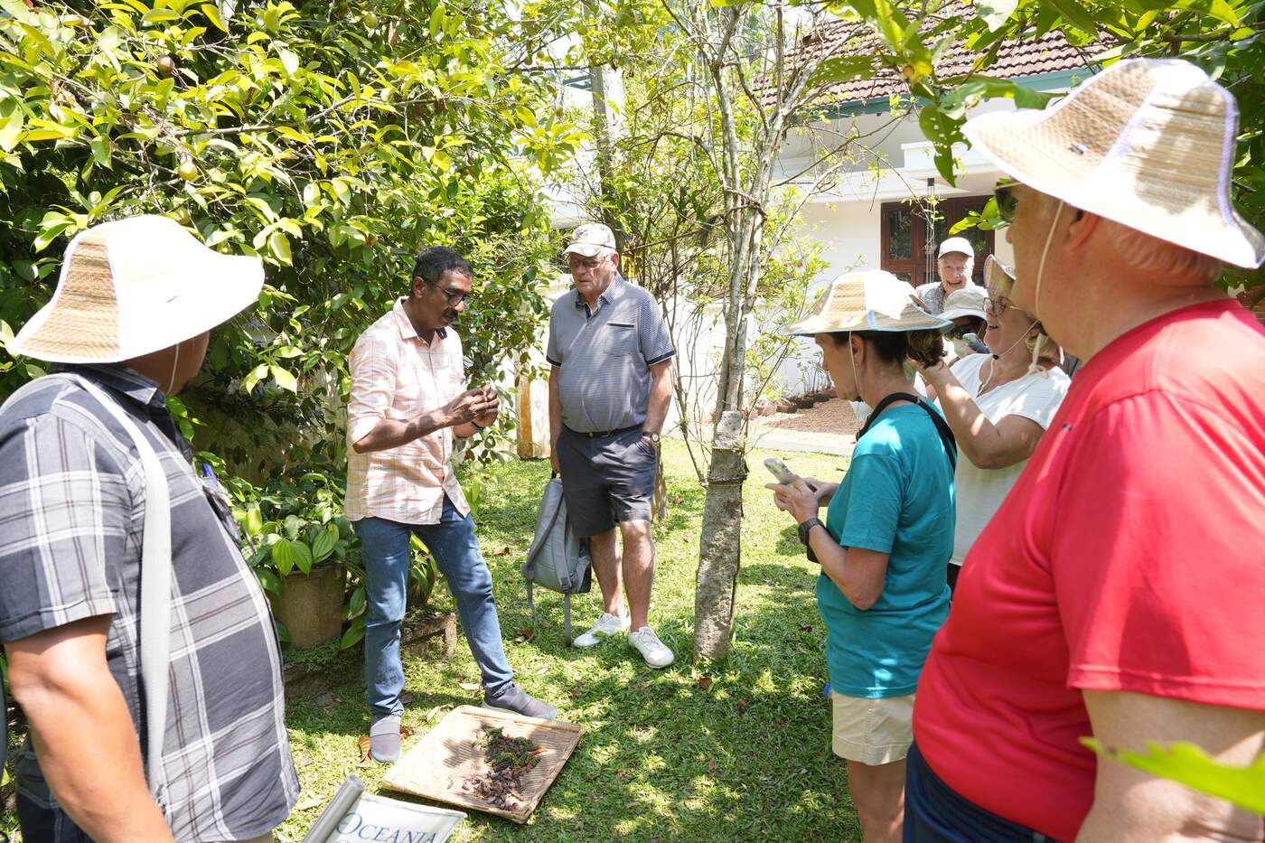 A local guide demonstrating traditional handwork to a small group